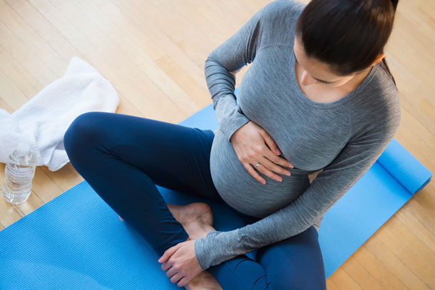 pregnant woman in yoga class